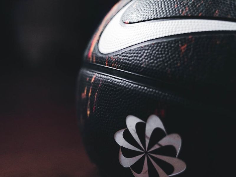 Sports equipment on a dark wooden floor in a studio