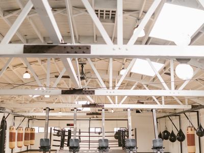 Wide view of an empty workout zone with mirrors